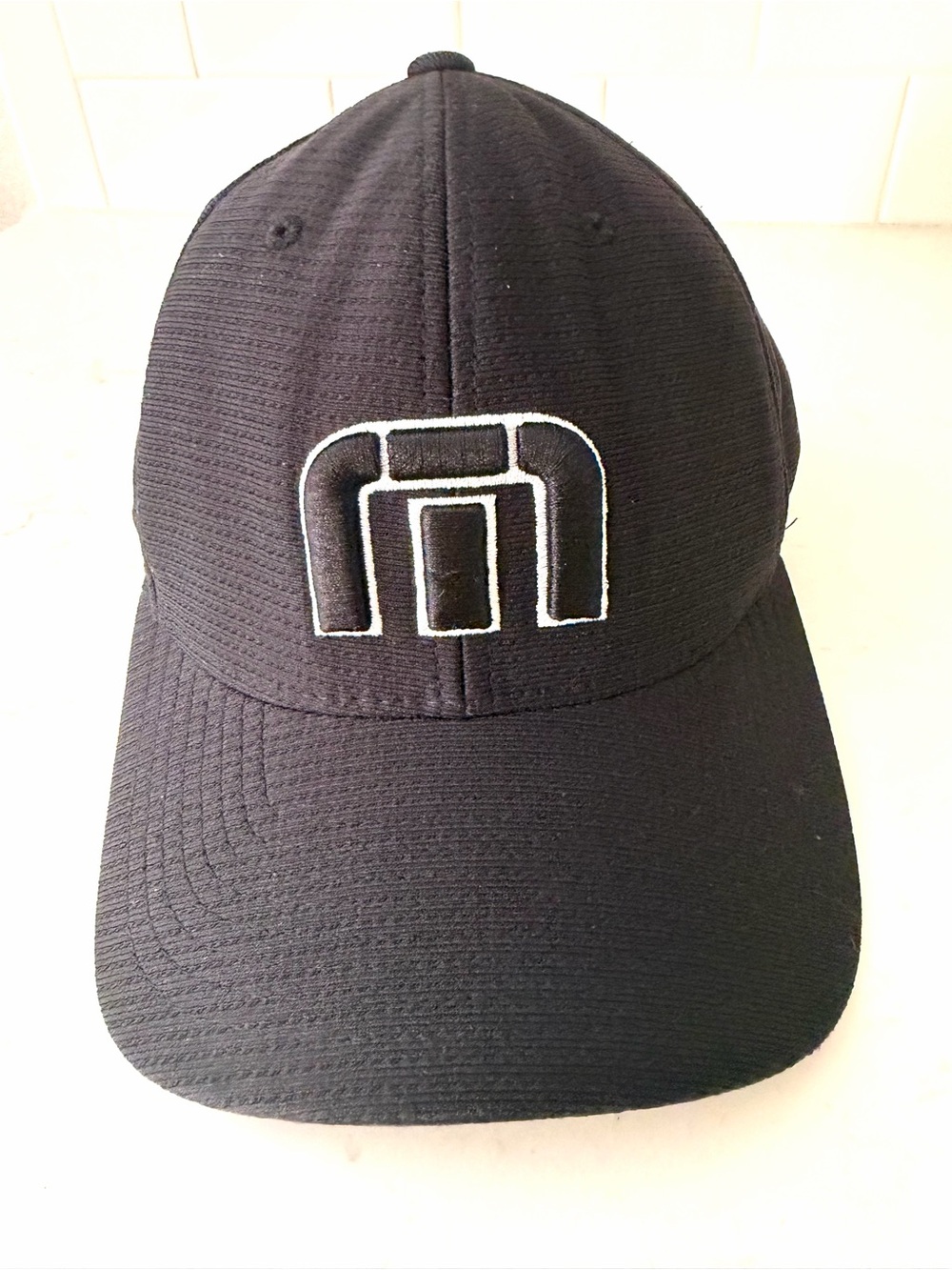 Travis Mathew Black Baseball Cap with White/Black Embroidered Logo